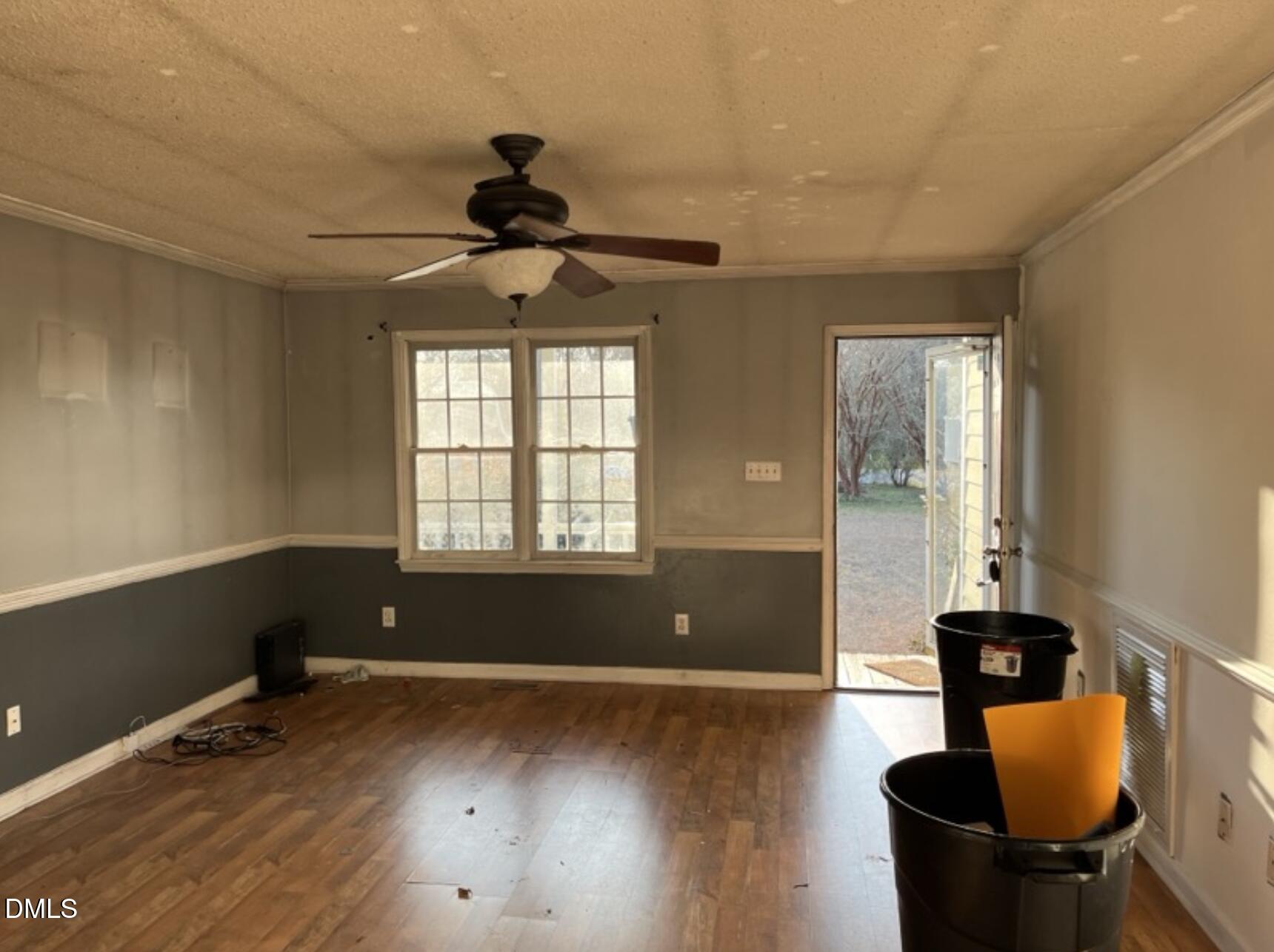 370 Sanders Road Benson, NC 27504 - Photo 3 of 13 a living room with hard wood floors and a window