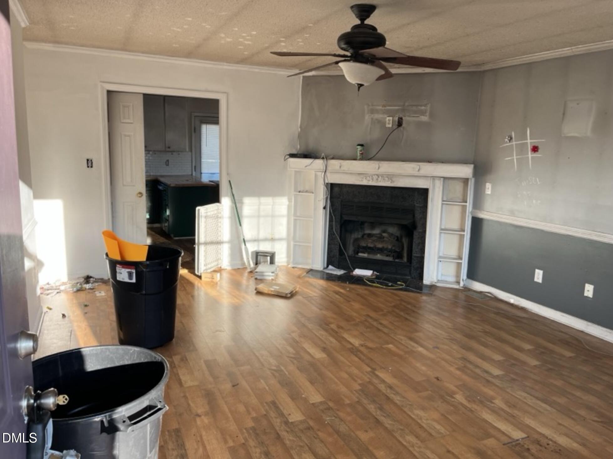 370 Sanders Road Benson, NC 27504 - Photo 4 of 13 a living room with furniture and a fireplace