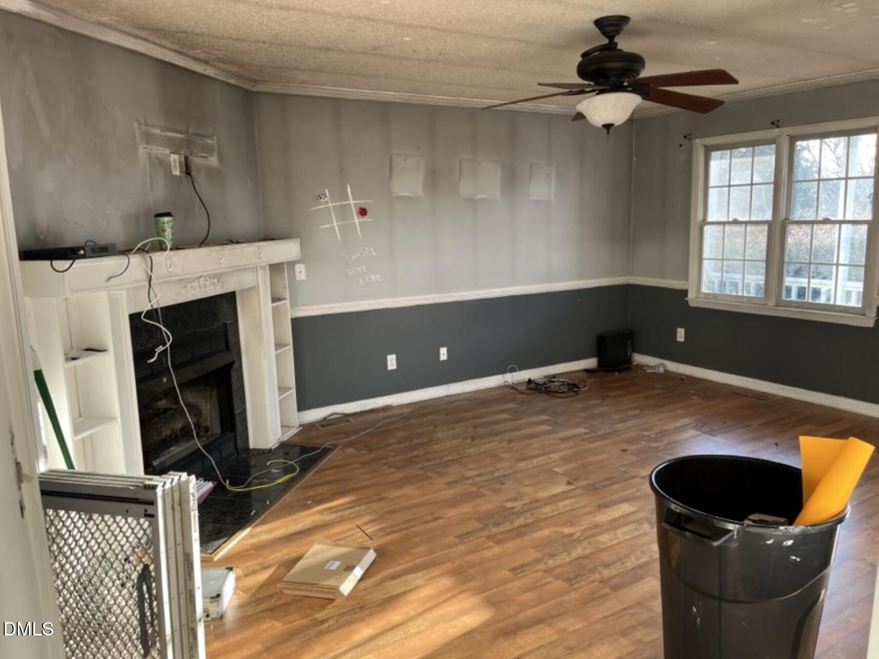 370 Sanders Road Benson, NC 27504 - Photo 5 of 13 a room with furniture and a fireplace