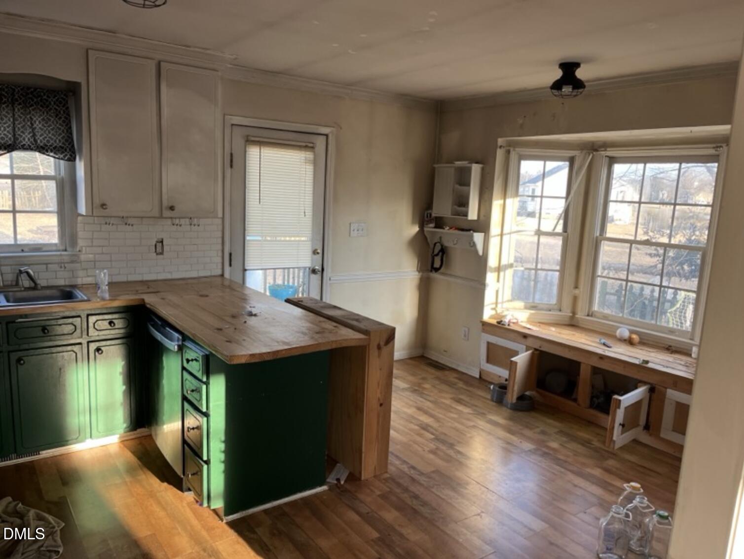 370 Sanders Road Benson, NC 27504 - Photo 8 of 13 a kitchen with a stove and a sink