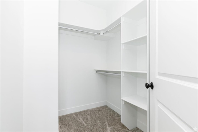 314 North 200 West Logan, UT 84321 - Photo 27 of 37 Walk in closet featuring light colored carpet