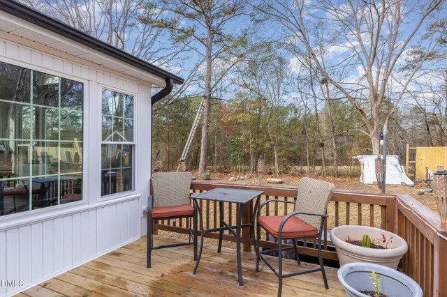 a view of a patio with iron fence