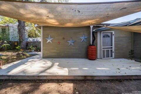 a view of backyard with cabin