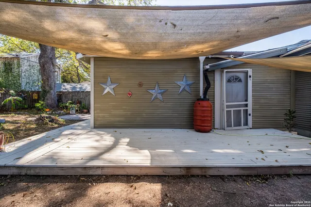 a view of backyard with cabin