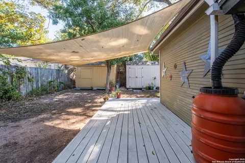 a view of a backyard with sitting area