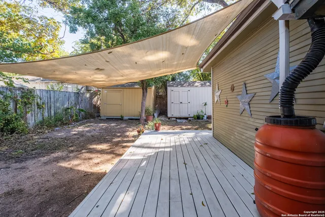 a view of a backyard with sitting area