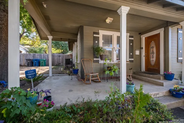 a backyard of a house with outdoor seating
