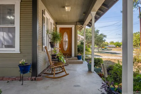 a view of a chair and tables in balcony