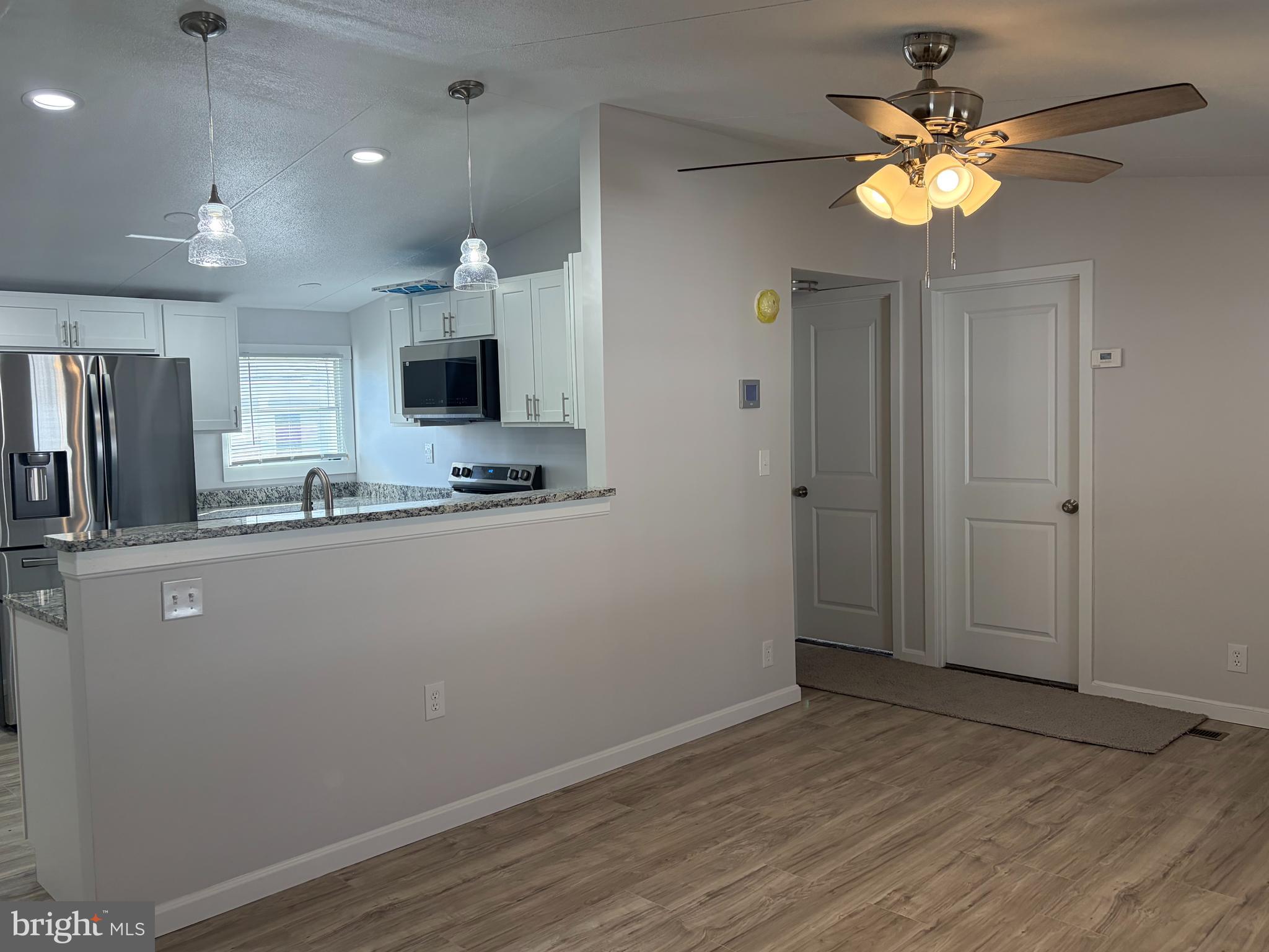 7 Roseview Road Dundalk, MD 21222 - Photo 4 of 13 a view of kitchen with cabinets and wooden floor