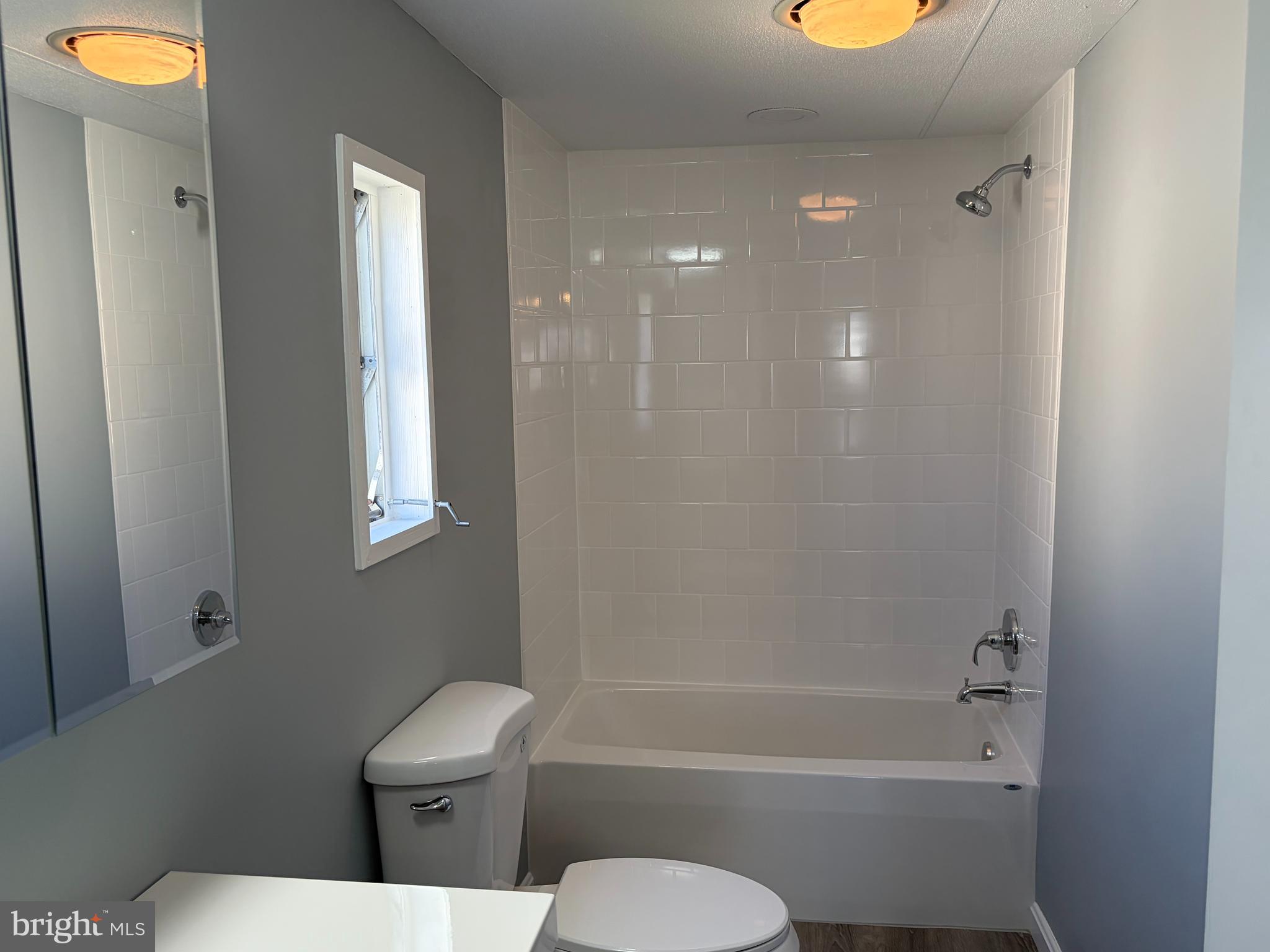 7 Roseview Road Dundalk, MD 21222 - Photo 8 of 13 a bathroom with a toilet and a shower