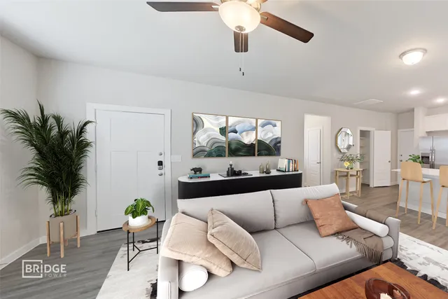 a living room with furniture and a large window