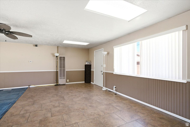 7050 South 260 East Midvale, UT 84047 - Photo 5 of 28 Spacious interior featuring tile flooring and wainscoting