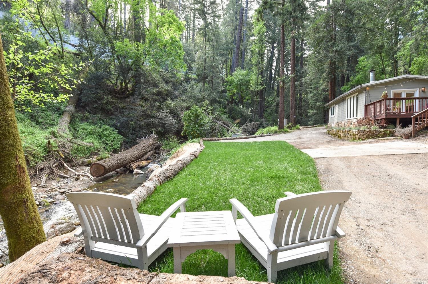 4520 Redwood Road Napa, CA 94558 - Photo 1 of 1 a view of a patio with two chairs and a table