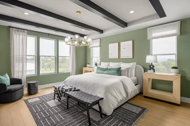 a bedroom with a bed and a couch