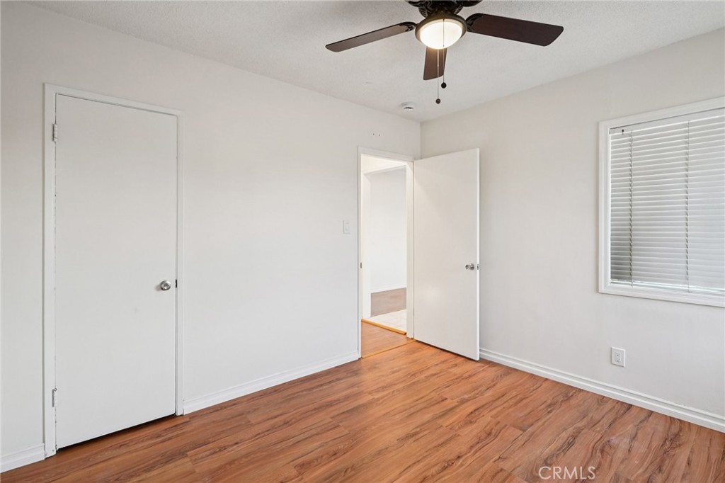 732 East Charron Place Compton, CA 90220 - Photo 14 of 24 wooden floor in an empty room with a window