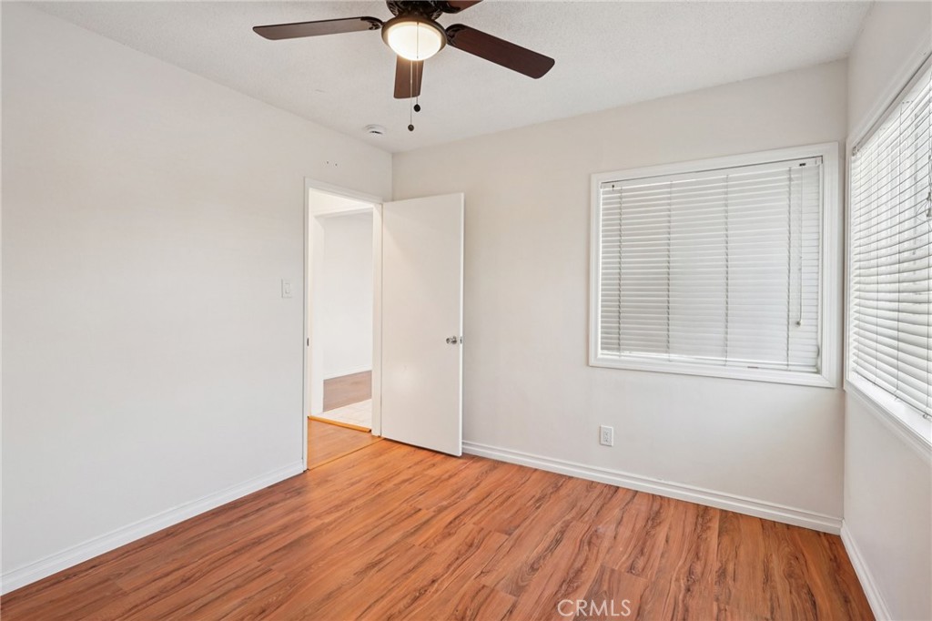 732 East Charron Place Compton, CA 90220 - Photo 15 of 24 wooden floor in an empty room with a window