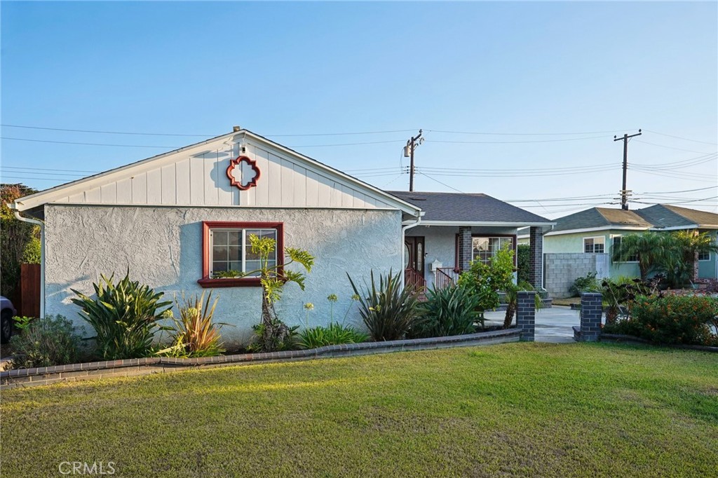732 East Charron Place Compton, CA 90220 - Photo 2 of 24 a front view of a house with garden