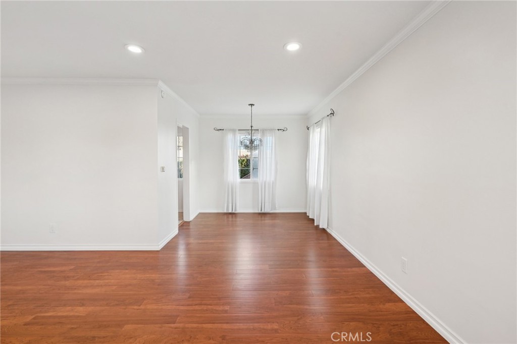 732 East Charron Place Compton, CA 90220 - Photo 4 of 24 a view of an empty room with wooden floor and staircase