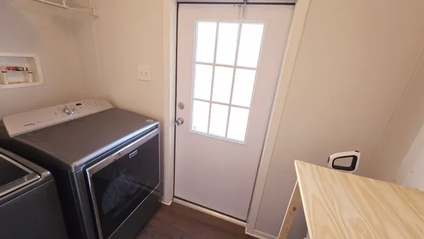 a view of a room with washing machine