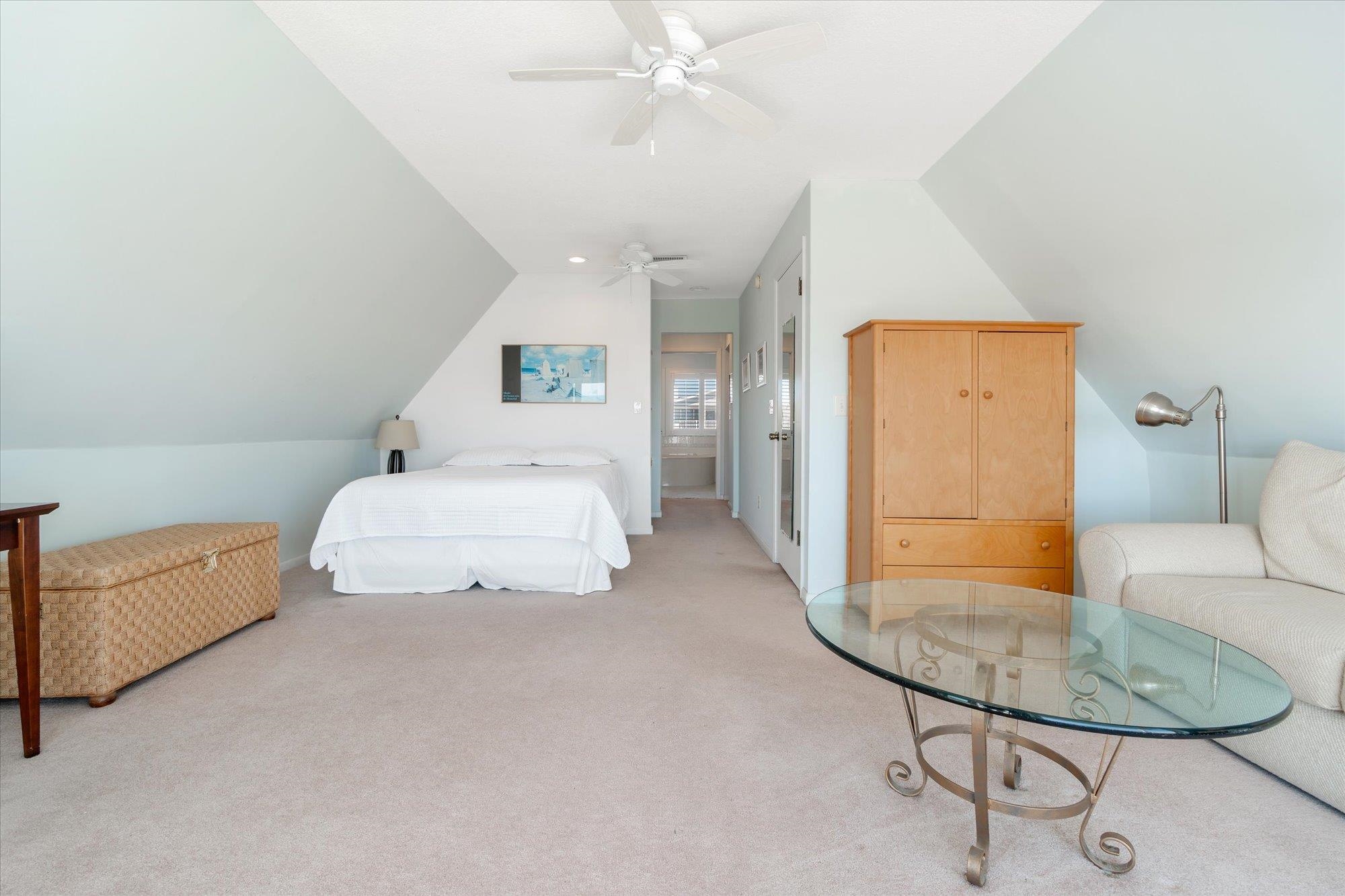 5512 Atlantic View St. Augustine, FL 32080 - Photo 26 of 77 Bedroom with light carpet, lofted ceiling, and ceiling fan