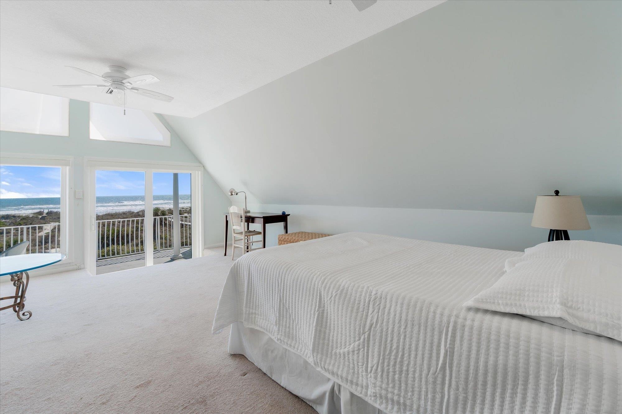 5512 Atlantic View St. Augustine, FL 32080 - Photo 28 of 77 Bedroom featuring ceiling fan, access to exterior, carpet, and lofted ceiling