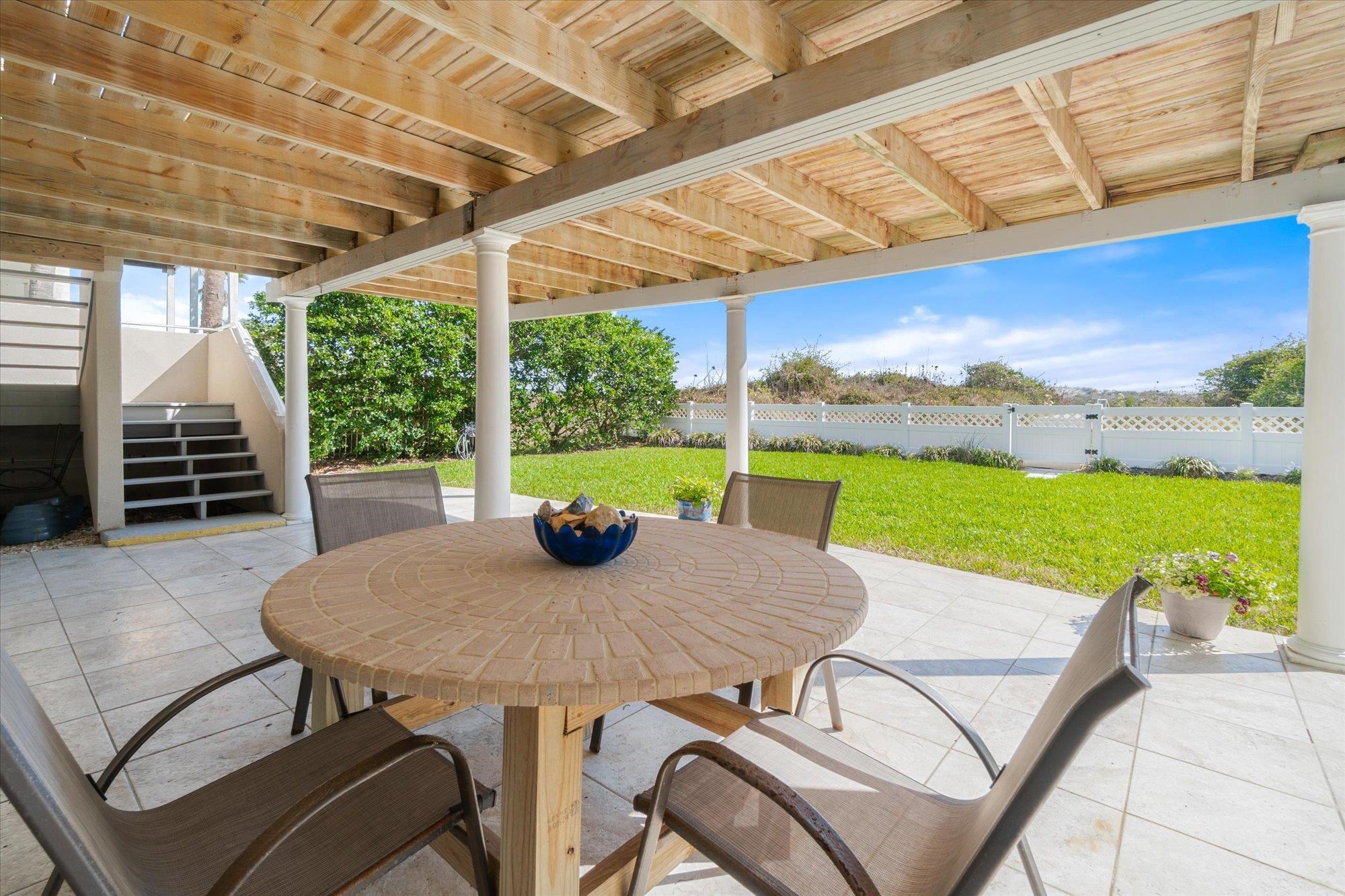 5512 Atlantic View St. Augustine, FL 32080 - Photo 45 of 77 Fenced backyard with outdoor dining area and a patio