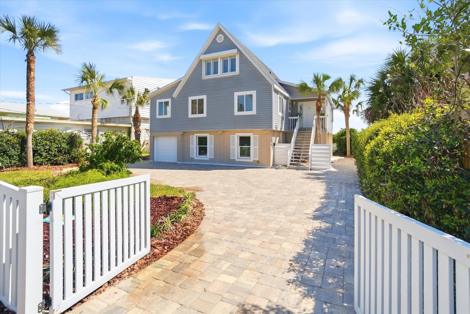 5512 Atlantic View St. Augustine, FL 32080 - Photo 5 of 77 View of front of house featuring decorative driveway and an attached garage
