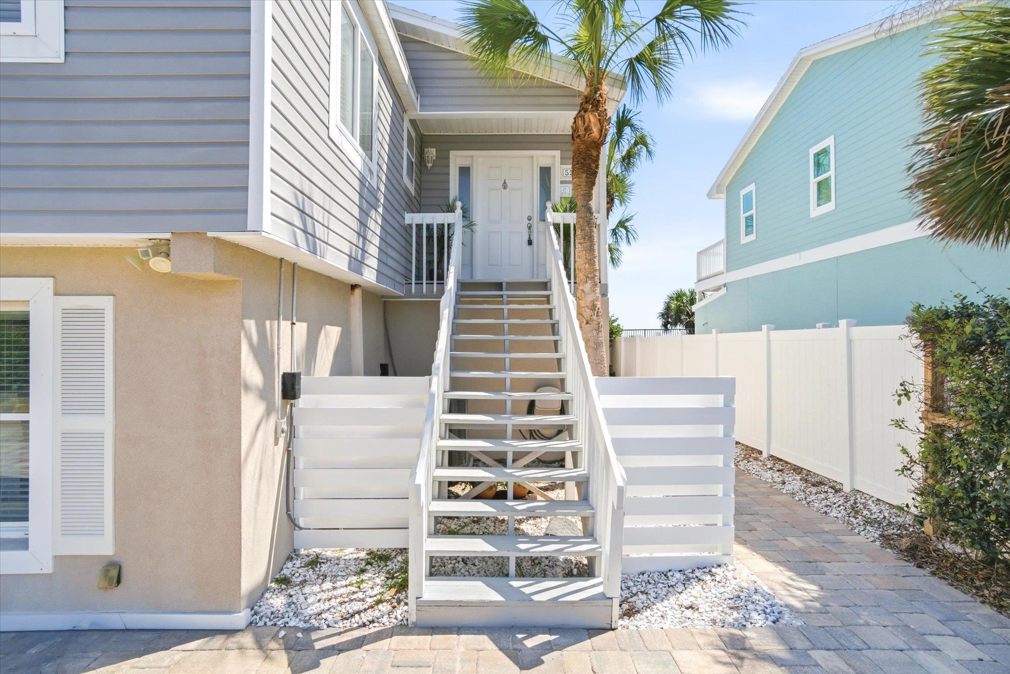 5512 Atlantic View St. Augustine, FL 32080 - Photo 6 of 77 View of exterior entry featuring stucco siding