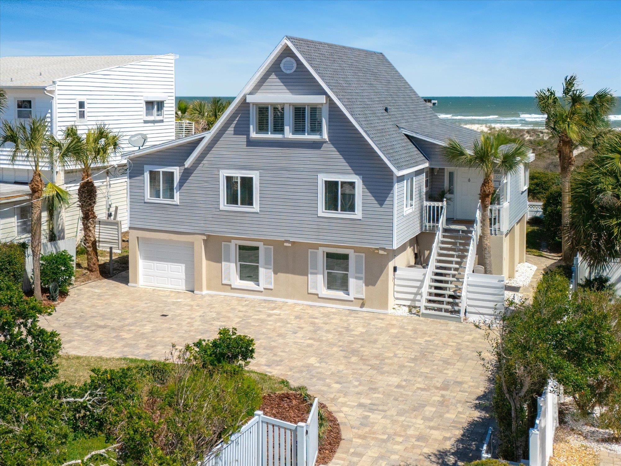 5512 Atlantic View St. Augustine, FL 32080 - Photo 70 of 77 View of front of property with an attached garage, decorative driveway, a water view, and a shingled roof