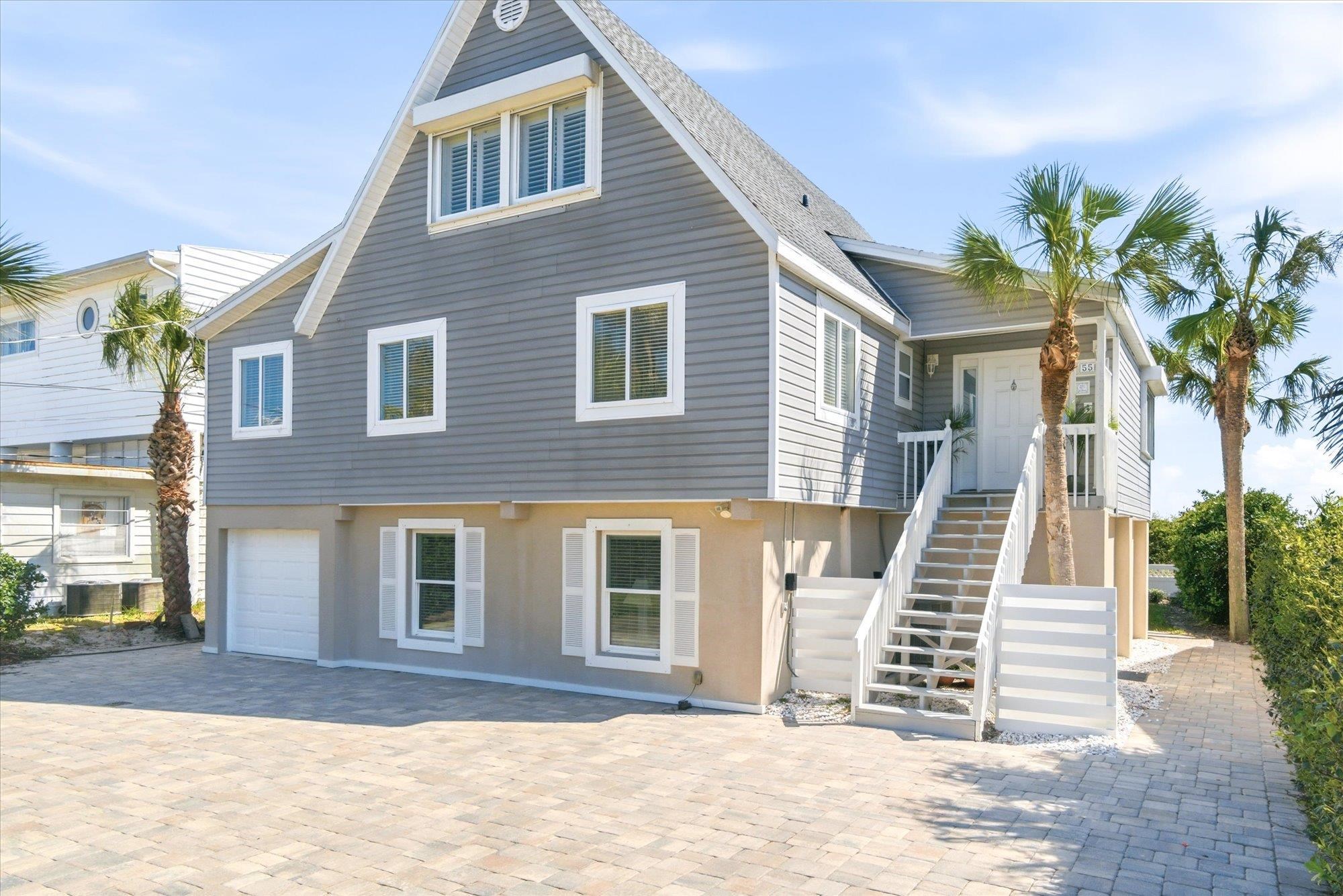 5512 Atlantic View St. Augustine, FL 32080 - Photo 72 of 77 View of front of home featuring a garage, stucco siding, and driveway