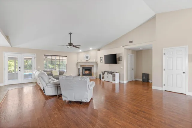 a living room with furniture and a fireplace