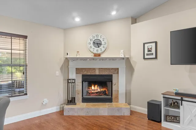 a kitchen with kitchen island granite countertop stainless steel appliances stove sink and cabinets