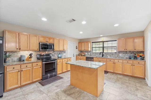 a workspace with furniture and window