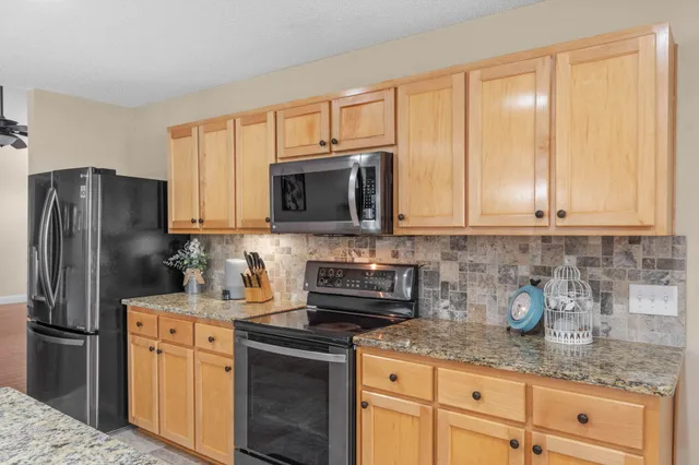 a bedroom with a bed and large window