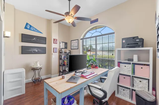 a bathroom with a granite countertop sink toilet a mirror a vanity and shower