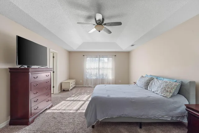 a view of a swimming pool with an outdoor seating