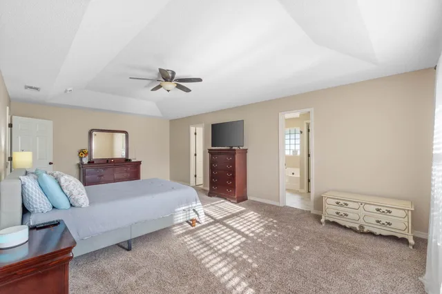 a view of a swimming pool with an outdoor seating and a yard