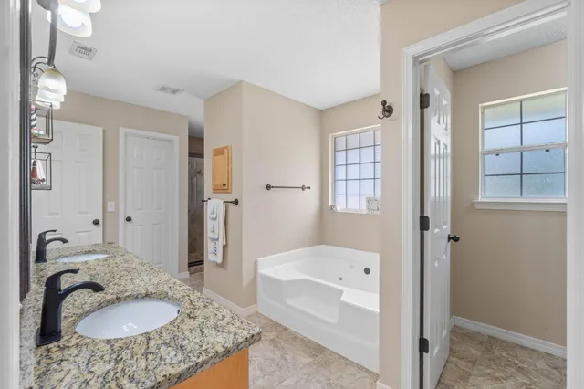 an aerial view of a house with a garden