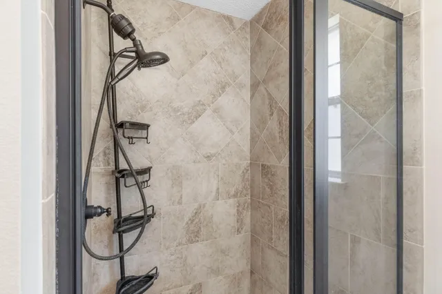 an aerial view of a house with a yard and swimming pool