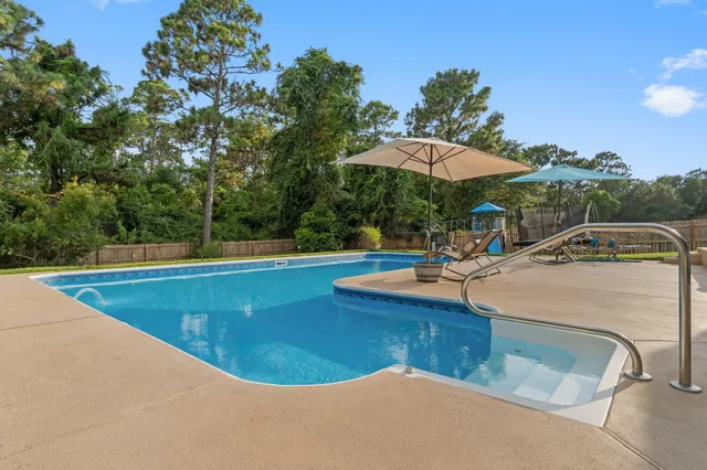a view of a lake with a floor to ceiling window