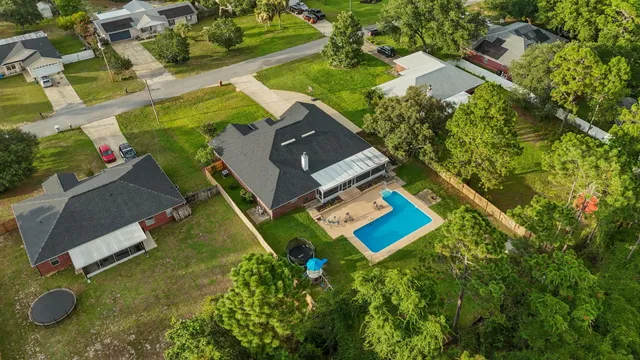 swimming pool with outdoor seating and yard