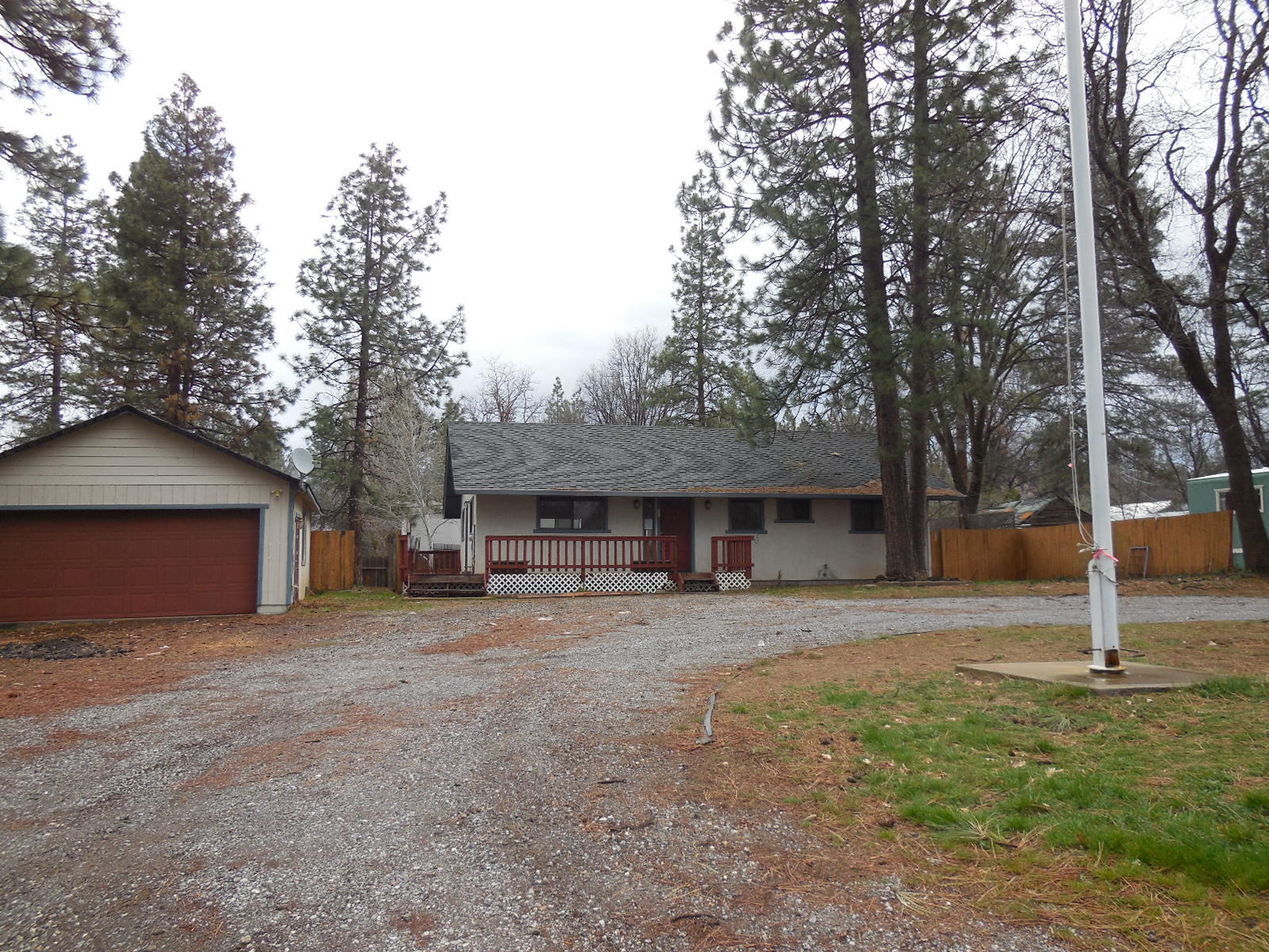 21729 2nd Street Burney, CA 96013 - Photo 17 of 26 a house with trees in the background