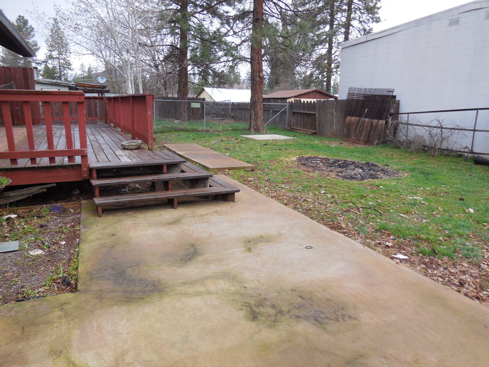 21729 2nd Street Burney, CA 96013 - Photo 20 of 26 a view of a backyard with wooden fence