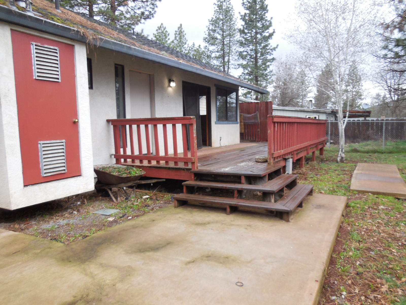 21729 2nd Street Burney, CA 96013 - Photo 24 of 26 a backyard of a house with barbeque oven and outdoor seating