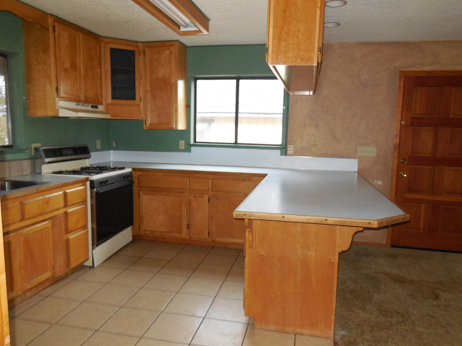 21729 2nd Street Burney, CA 96013 - Photo 3 of 26 a kitchen that has a sink and a stove