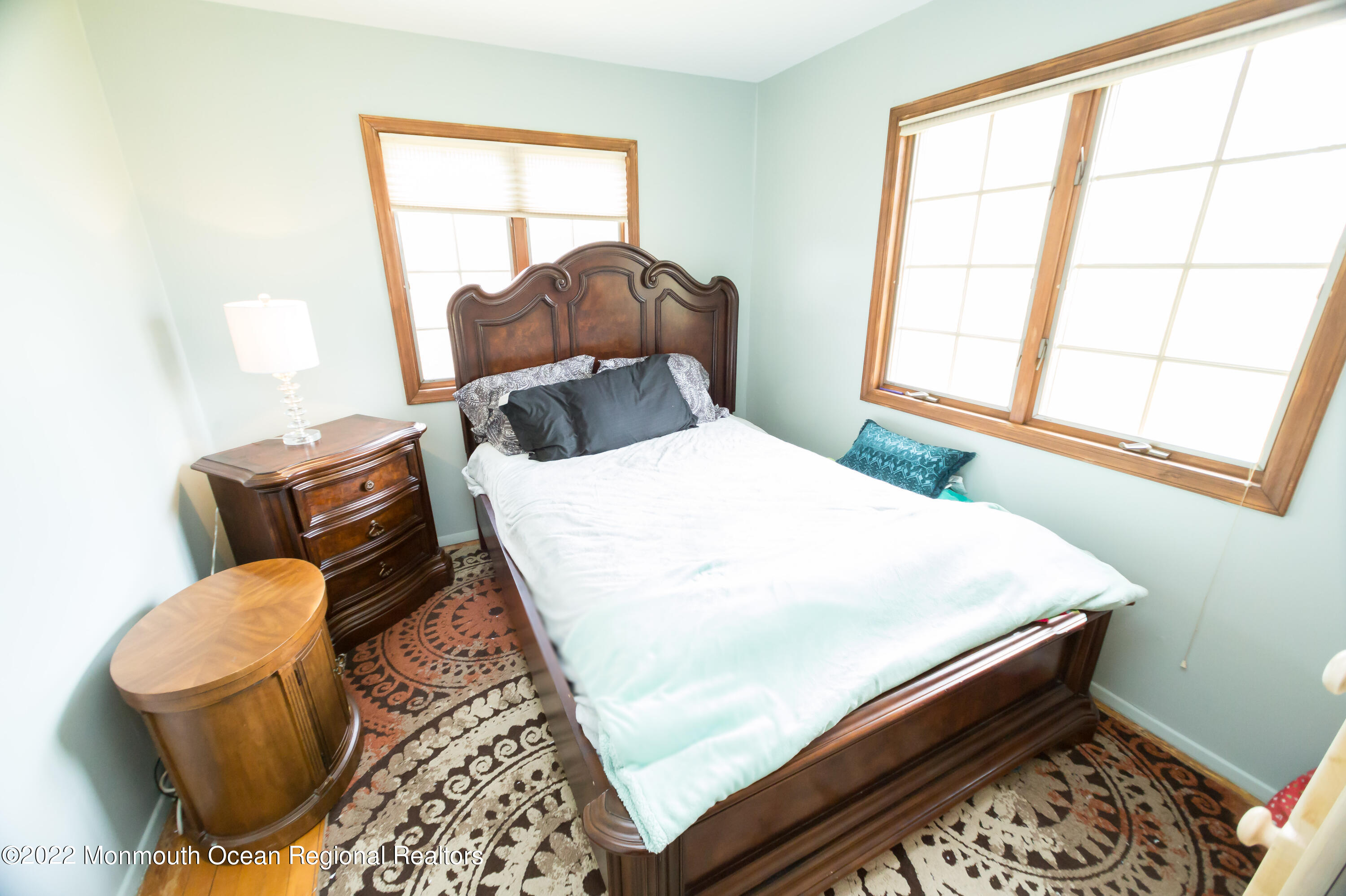 137 Cherry Tree Farm Road Middletown, NJ 07748 - Photo 19 of 36 a bed sitting in a bedroom next to a window