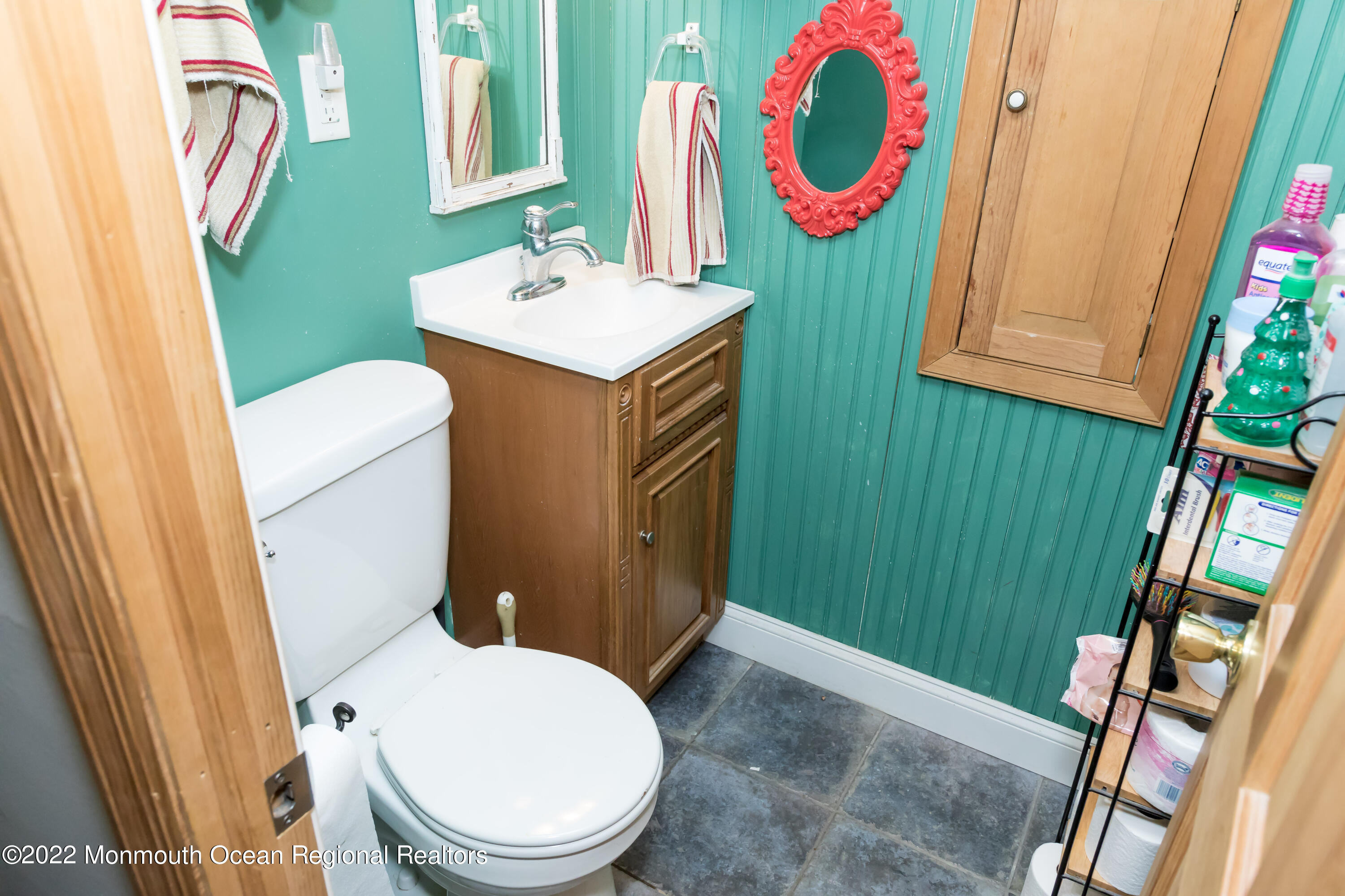 137 Cherry Tree Farm Road Middletown, NJ 07748 - Photo 29 of 36 a bathroom with a toilet sink and mirror