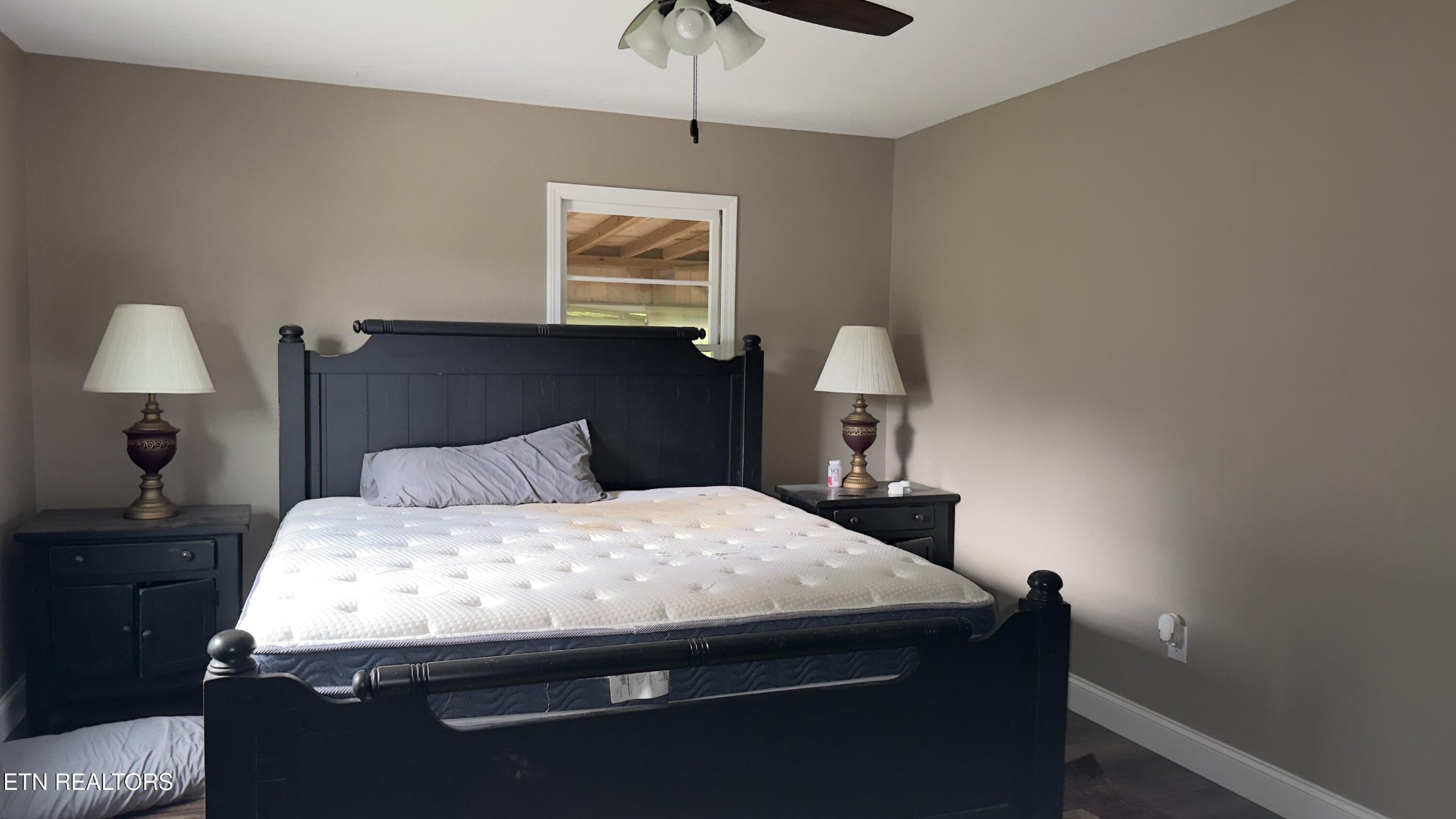 2662 Louisville Road Maryville, TN 37801 - Photo 21 of 60 a bedroom with a bed and a chandelier