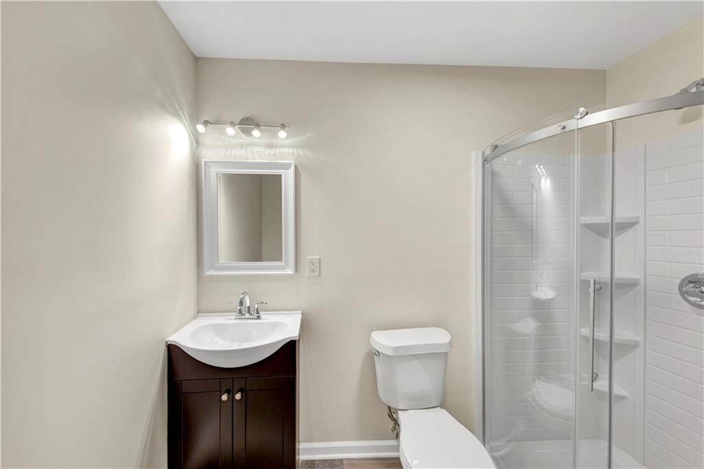 2880 Field Spring Drive Lithonia, GA 30058 - Photo 6 of 31 a bathroom with a sink toilet and shower