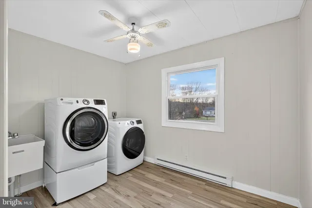 a white toilet sitting next to a bathroom sink